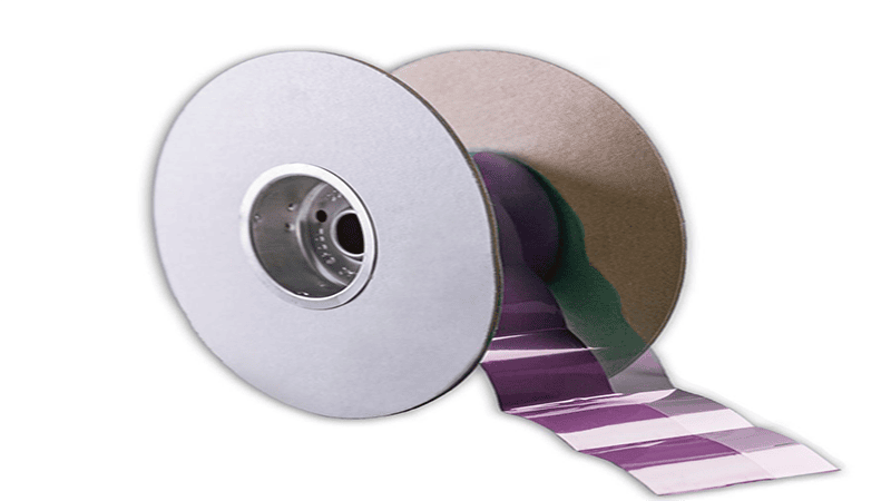 Image of Honeywell PTM7950 phase change material on a roll, illustrating its form factor for manufacturing and application, with a purple-colored surface.