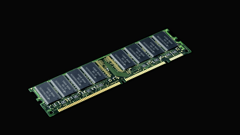 DDR RAM module (desktop memory stick with black chips on green PCB, isolated on black background)