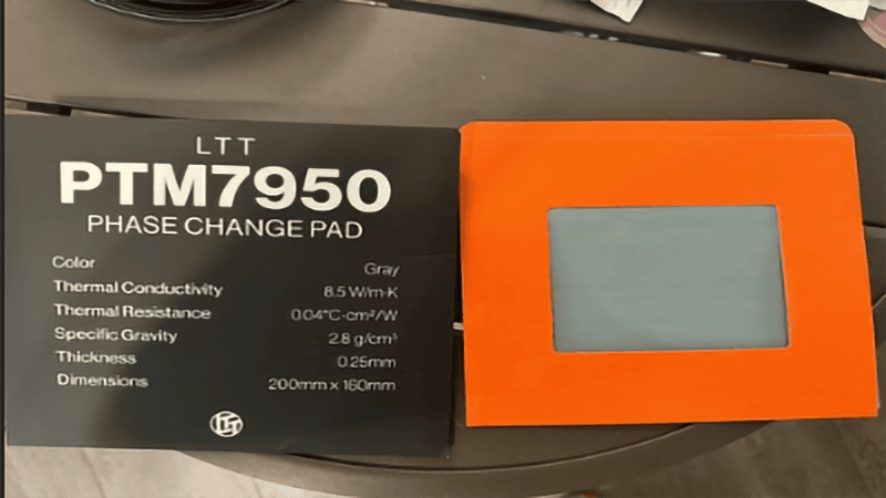LTT PTM7950 Phase Change Pad retail packaging next to its protective sleeve, clearly displaying product specifications like 8.5 W/m·K thermal conductivity and 0.04 °C·cm²/W thermal resistance.