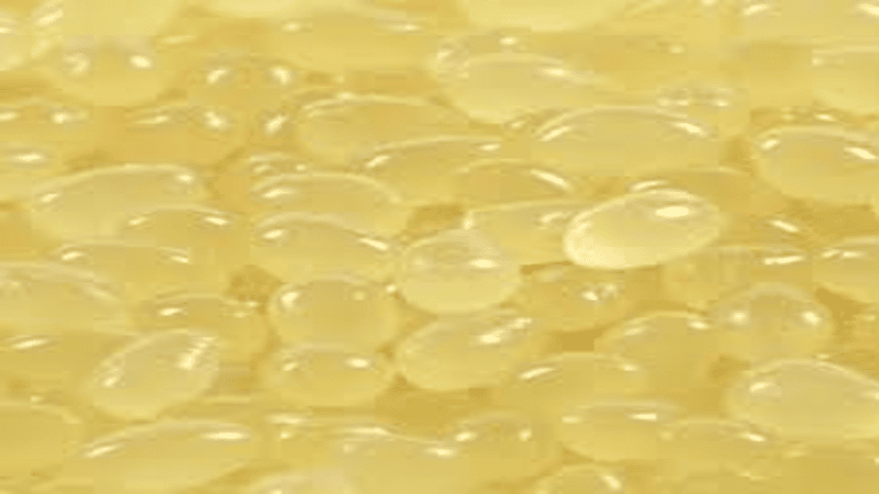 Yellow hot melt adhesive particles