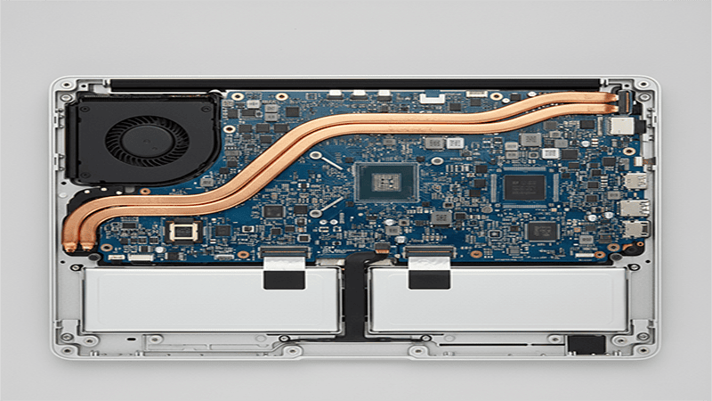 Internal architecture of MacBook Pro M1 showing logic board, battery, and cooling system before thermal pad upgrade